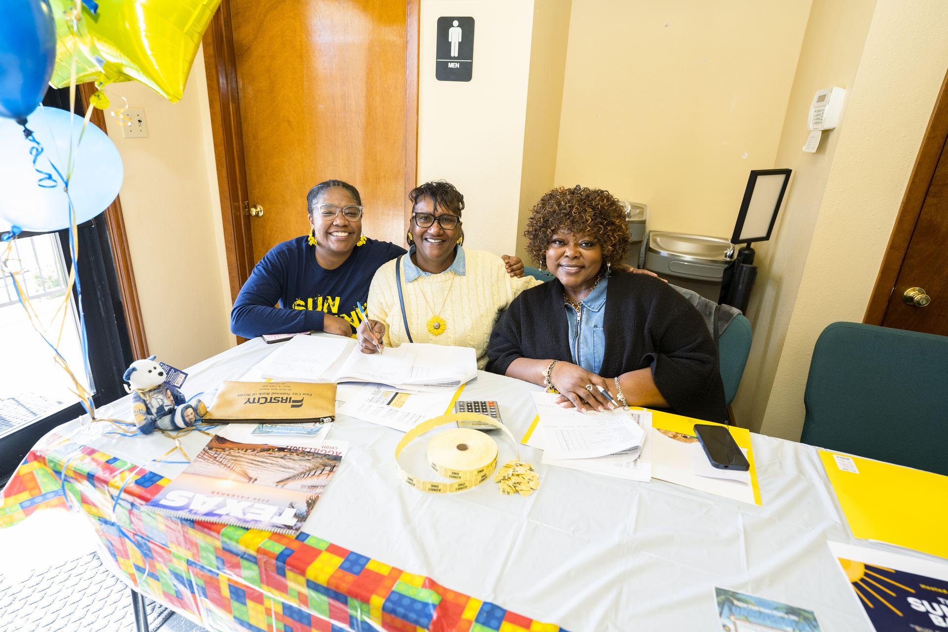 Sunshine Band members welcoming guests at the registration table